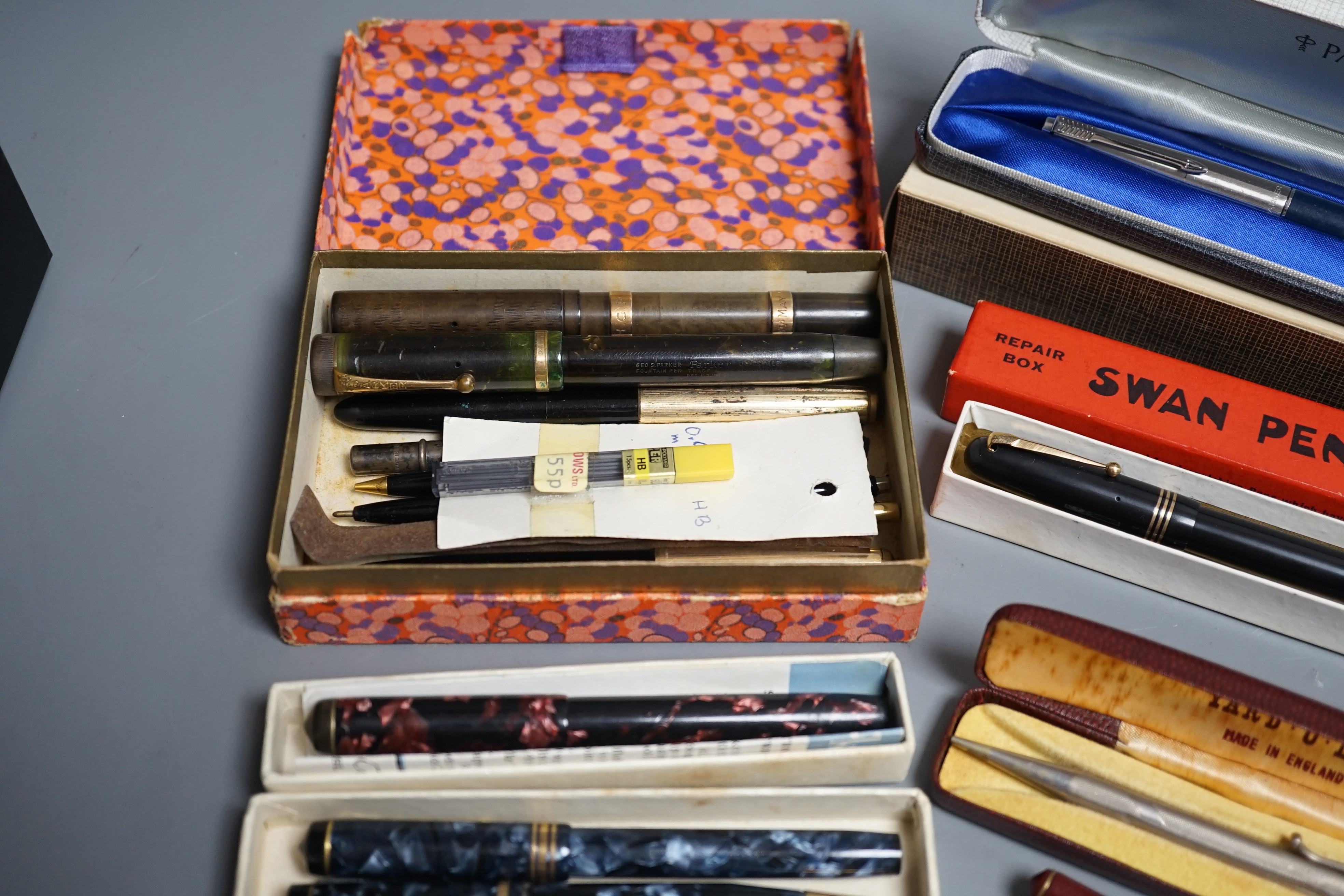 A group of fountain pens and pencils including a Waterman's ideal gold mounted pen